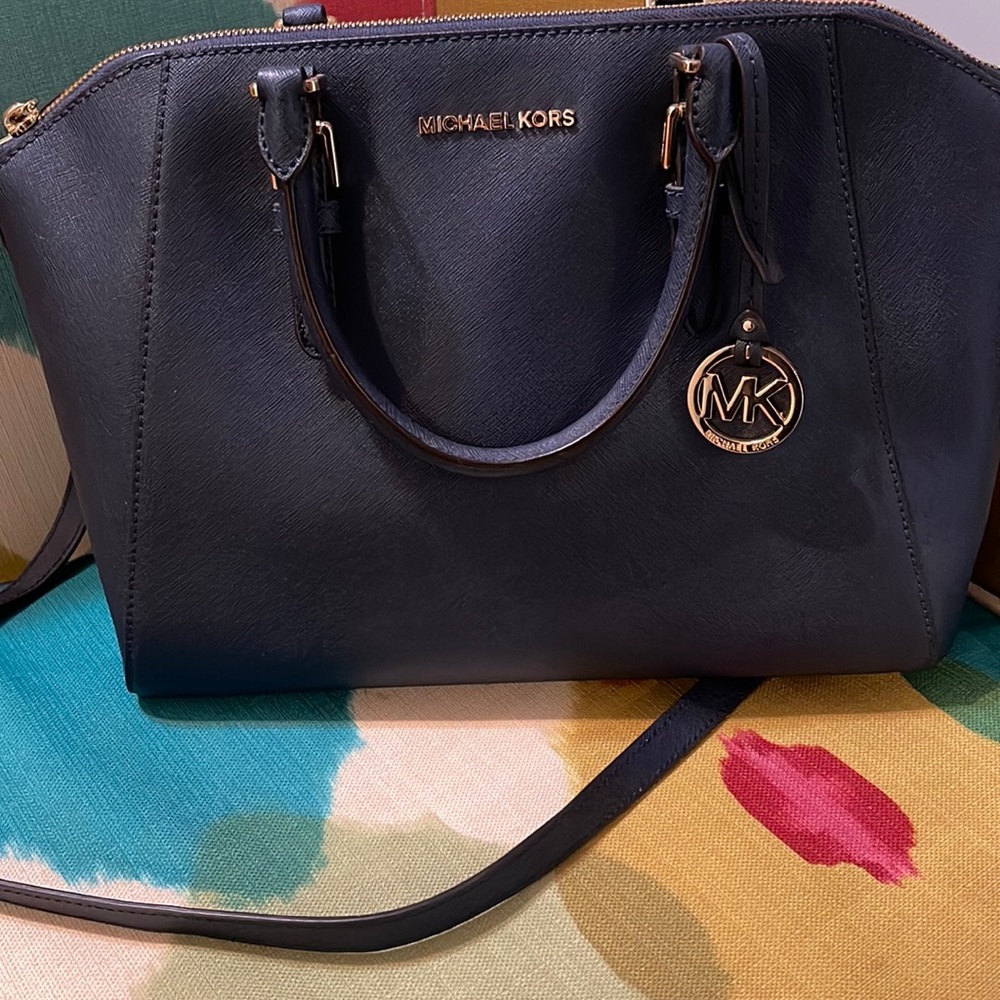 Micheal kors navy blue basically brand new used once or twice